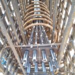 A large multi-strand anchorage for a post-tensioning system integrated within a complex rebar cage before concrete is poured.